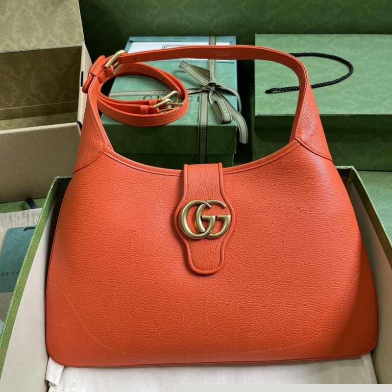 G*u*i top handle bags